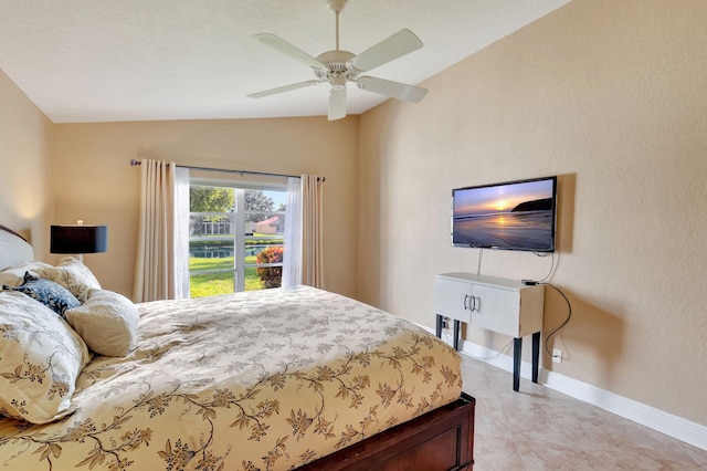 bedroom featuring ceiling fan and lofted ceiling