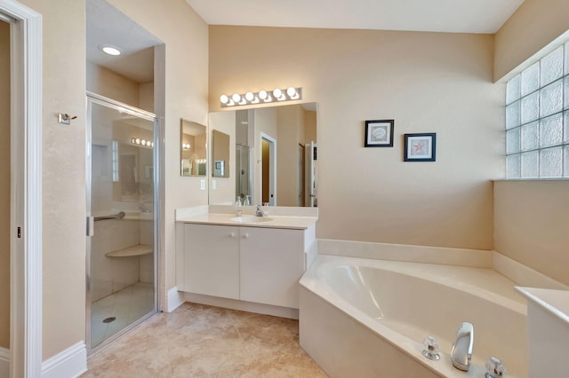 bathroom featuring tile patterned flooring, vanity, and independent shower and bath