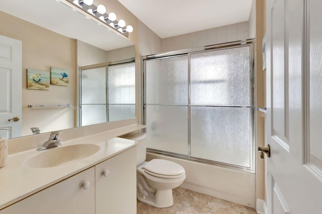 full bathroom with tile patterned flooring, vanity, enclosed tub / shower combo, and a wealth of natural light