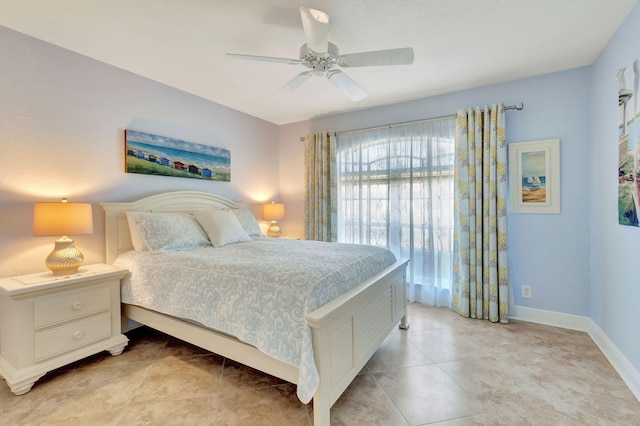 tiled bedroom with ceiling fan