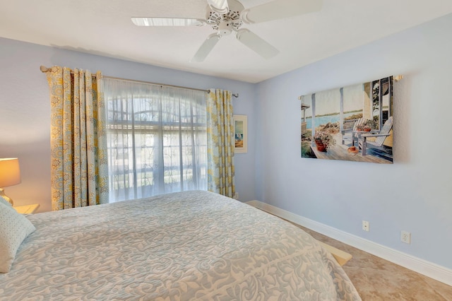 tiled bedroom with ceiling fan