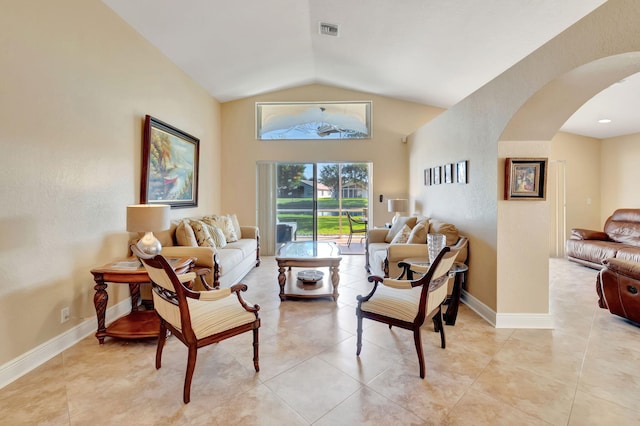 living room featuring light tile patterned flooring and lofted ceiling