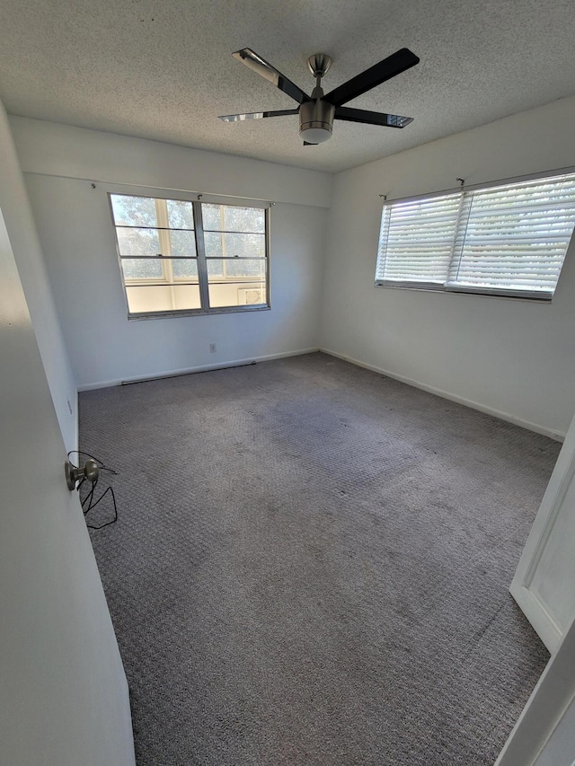 empty room with carpet, a textured ceiling, and ceiling fan