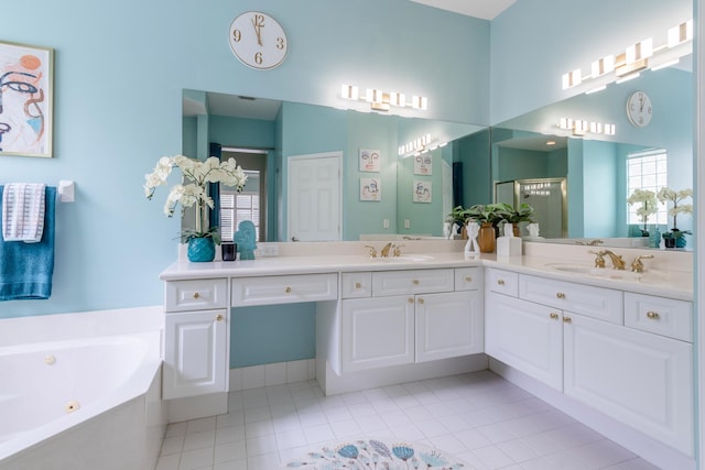 bathroom with tile patterned flooring, vanity, a wealth of natural light, and shower with separate bathtub