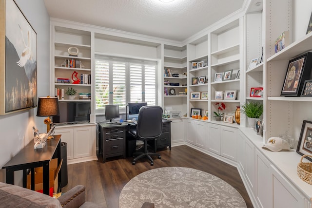 home office with dark hardwood / wood-style flooring and a textured ceiling