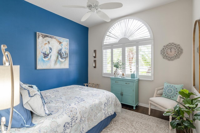 bedroom featuring hardwood / wood-style flooring and ceiling fan