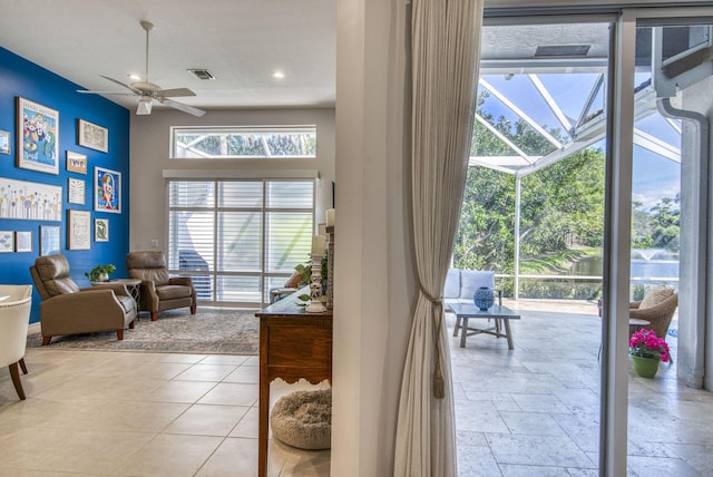 dining space with light tile patterned flooring and ceiling fan