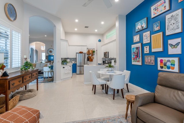 dining room featuring light tile patterned floors and ceiling fan