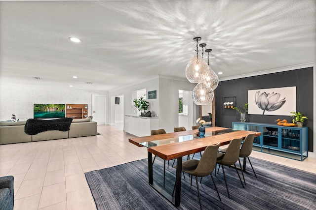 dining space with crown molding, light tile patterned flooring, and a textured ceiling