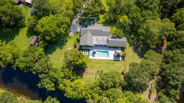 birds eye view of property with a water view