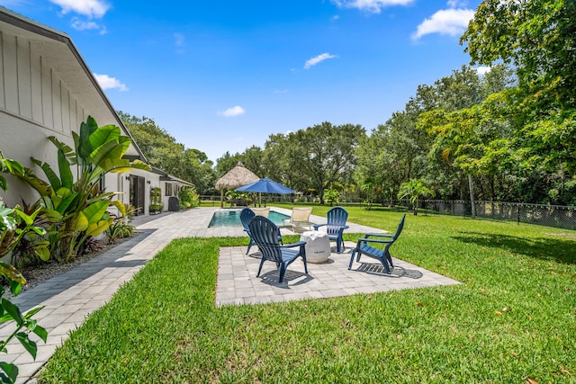 view of yard with a fenced in pool and a patio area