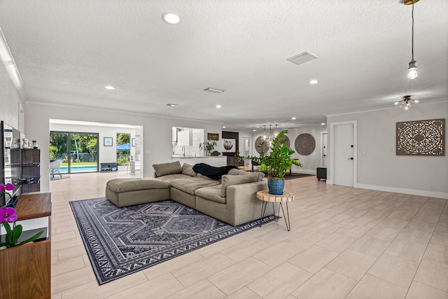 living room featuring crown molding and a textured ceiling