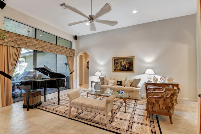 tiled living room with ceiling fan