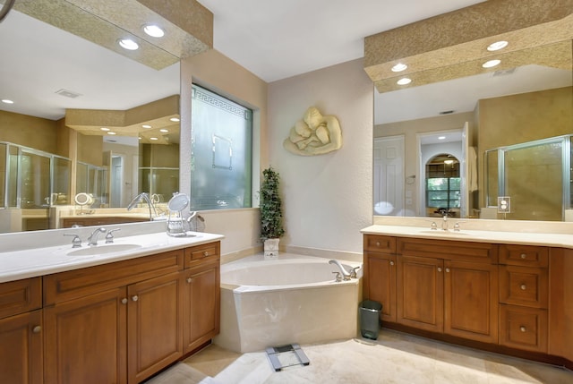 bathroom with separate shower and tub and vanity