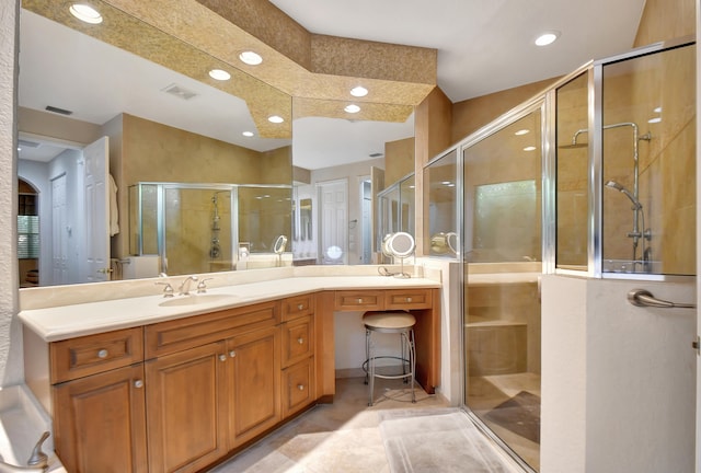 bathroom featuring vanity and a shower with door