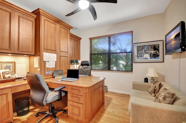 office space featuring light wood-type flooring and ceiling fan