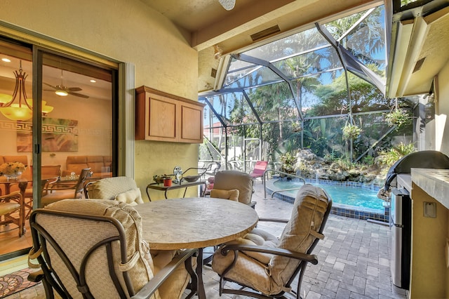 view of patio with pool water feature and a lanai