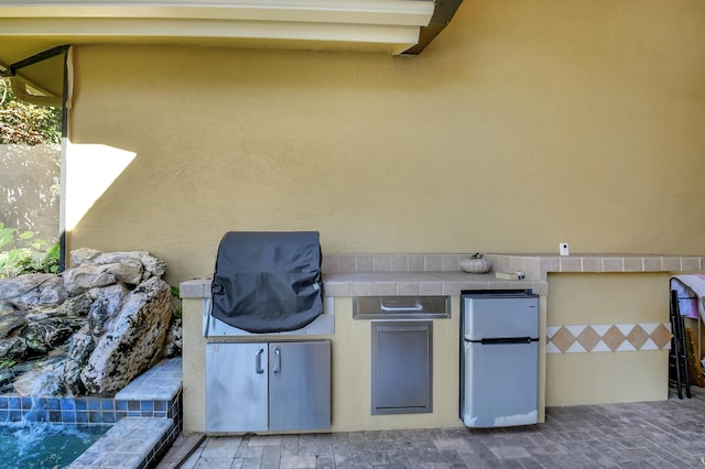 view of patio / terrace featuring exterior kitchen