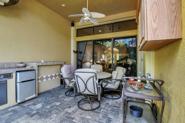 view of patio with ceiling fan