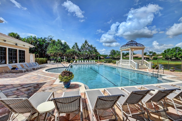 view of pool with a gazebo and a patio area