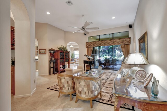 living room featuring ceiling fan and light tile patterned flooring