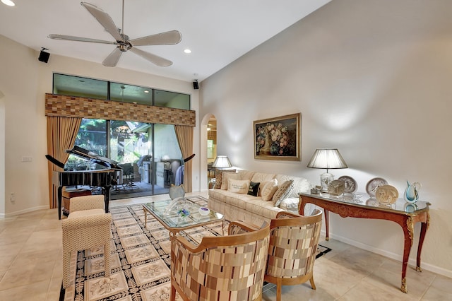 tiled living room with ceiling fan