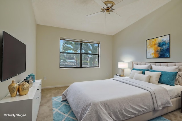 carpeted bedroom with lofted ceiling and ceiling fan