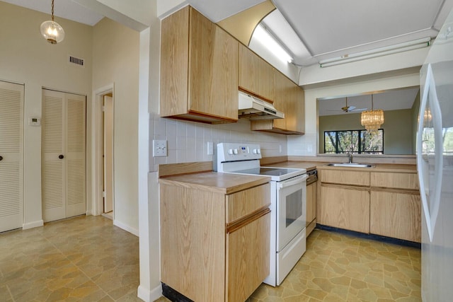 kitchen with pendant lighting, light brown cabinetry, tasteful backsplash, white appliances, and an inviting chandelier