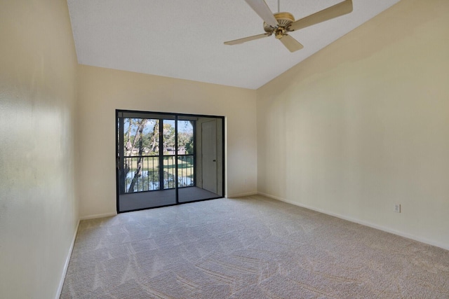 spare room with light carpet, high vaulted ceiling, and ceiling fan