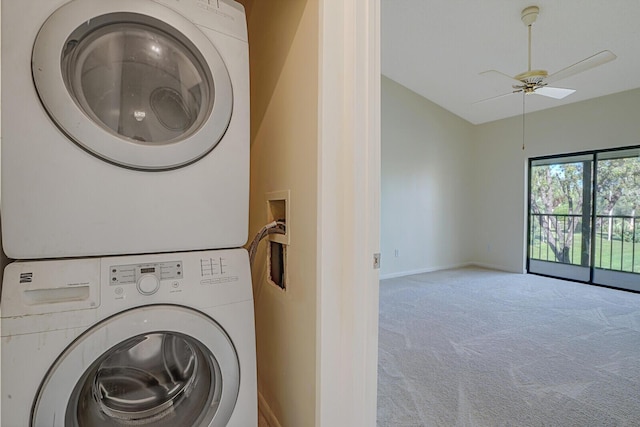 laundry area with ceiling fan, stacked washer and clothes dryer, and carpet floors