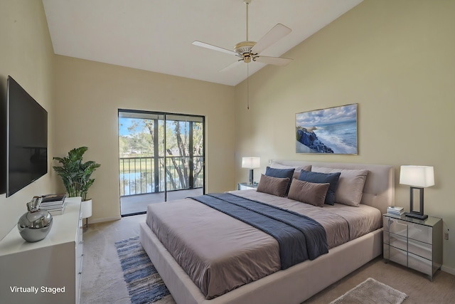 bedroom featuring ceiling fan, access to exterior, high vaulted ceiling, and light carpet