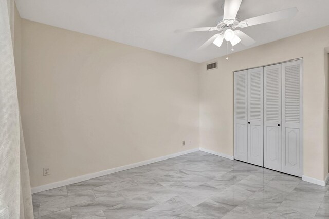 unfurnished bedroom with a closet and ceiling fan