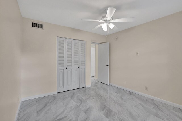 unfurnished bedroom featuring a closet and ceiling fan