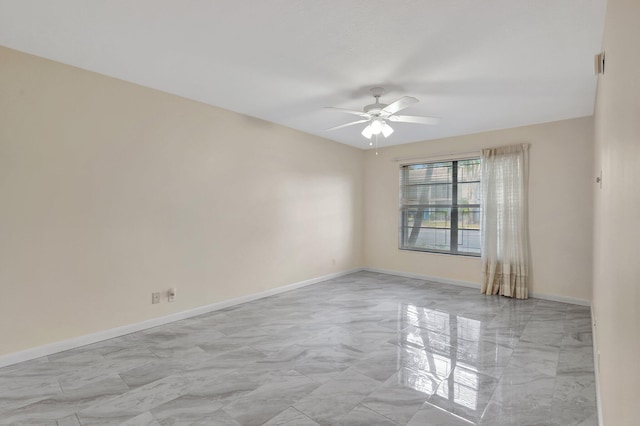 spare room with ceiling fan