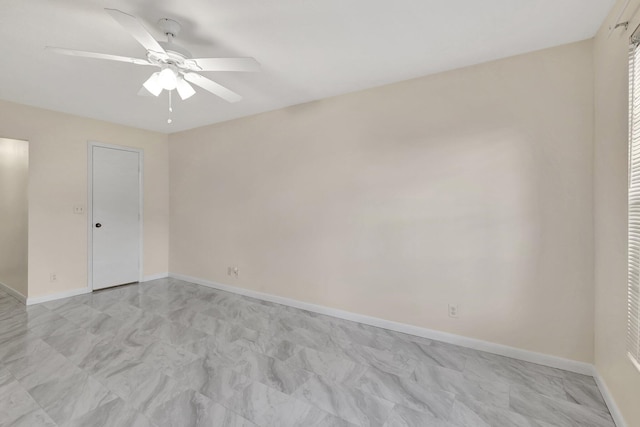 spare room with ceiling fan