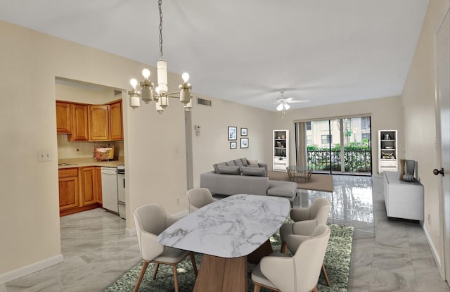 dining room with ceiling fan with notable chandelier