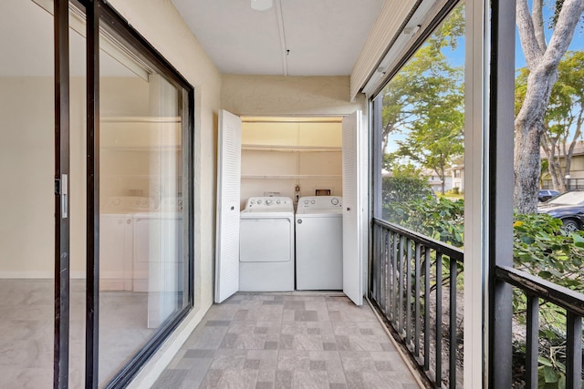 balcony with washer and clothes dryer