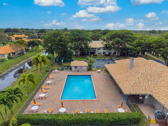 view of swimming pool featuring central air condition unit