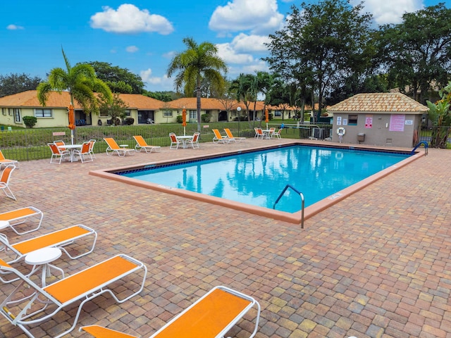 view of swimming pool featuring a patio area