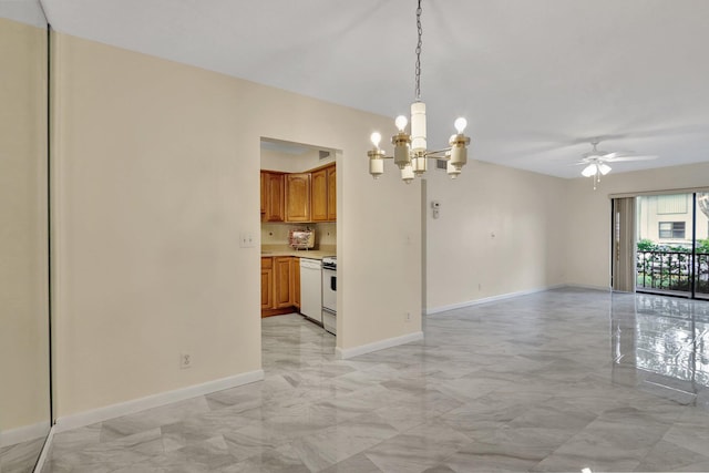 kitchen featuring ceiling fan with notable chandelier, hanging light fixtures, and white stove