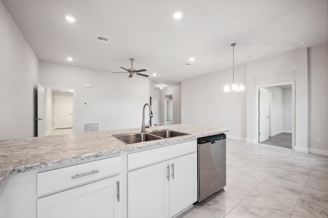 kitchen with stainless steel dishwasher, ceiling fan with notable chandelier, sink, decorative light fixtures, and white cabinetry