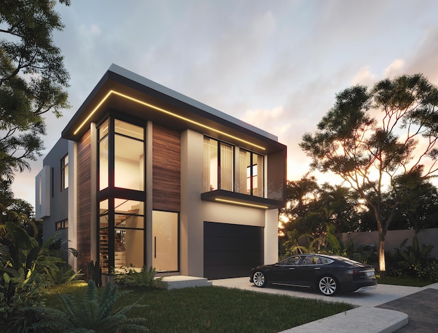 property exterior at dusk featuring a garage