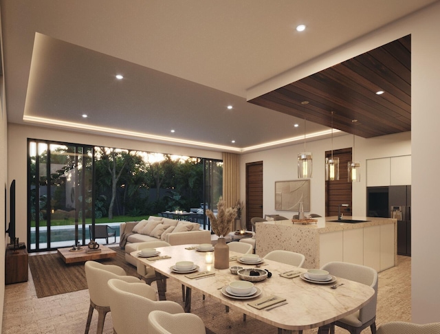 dining space featuring light colored carpet and sink