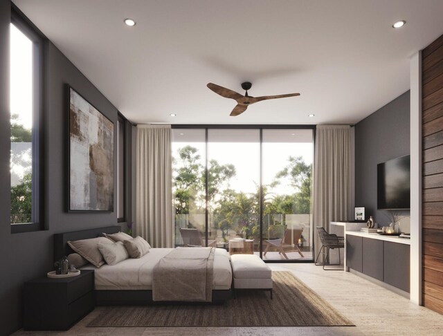 bedroom with floor to ceiling windows, light wood-type flooring, access to outside, and ceiling fan