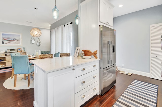 kitchen with light stone countertops, high end refrigerator, dark hardwood / wood-style flooring, decorative light fixtures, and white cabinets