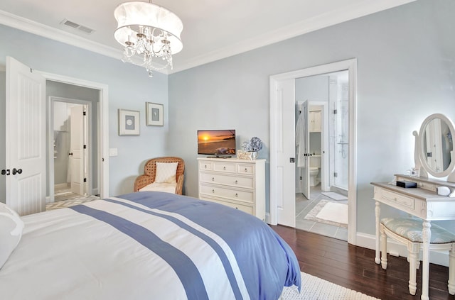 bedroom featuring connected bathroom, an inviting chandelier, dark wood-type flooring, and ornamental molding