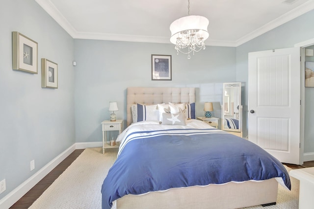 bedroom with dark hardwood / wood-style floors, crown molding, and a chandelier