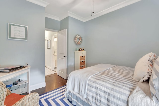 bedroom with crown molding and dark wood-type flooring