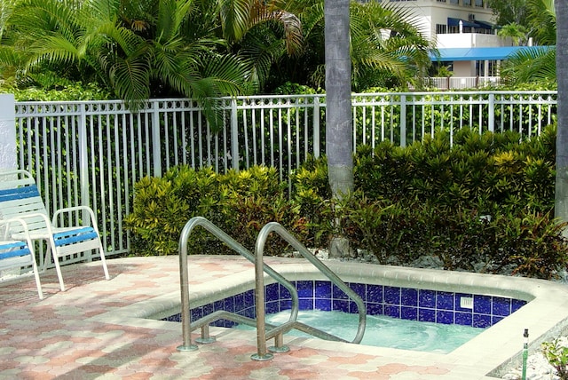 view of pool featuring a community hot tub