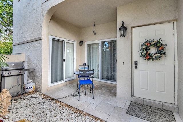 entrance to property with a patio area